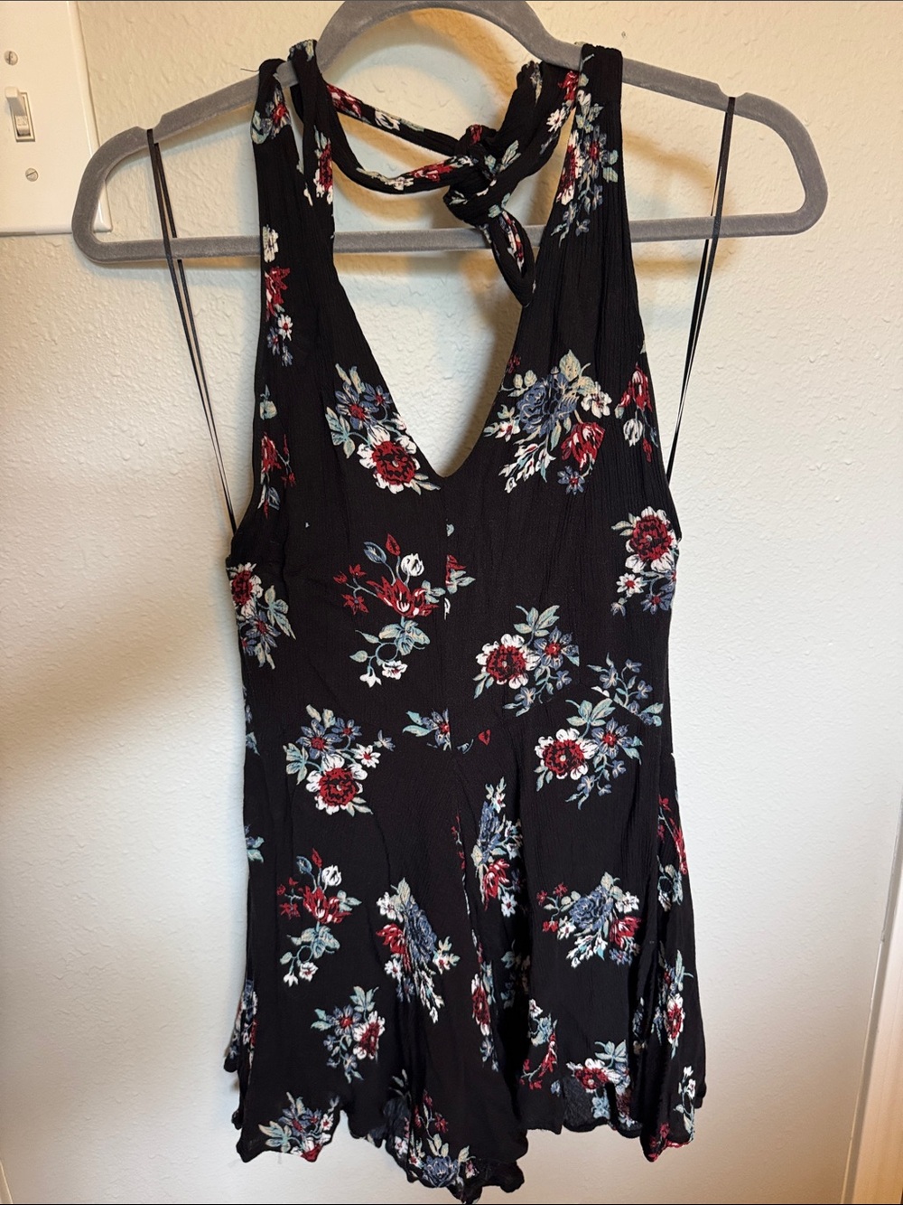 The Impeccable Pig Black Floral Romper with Red and Blue Flowers